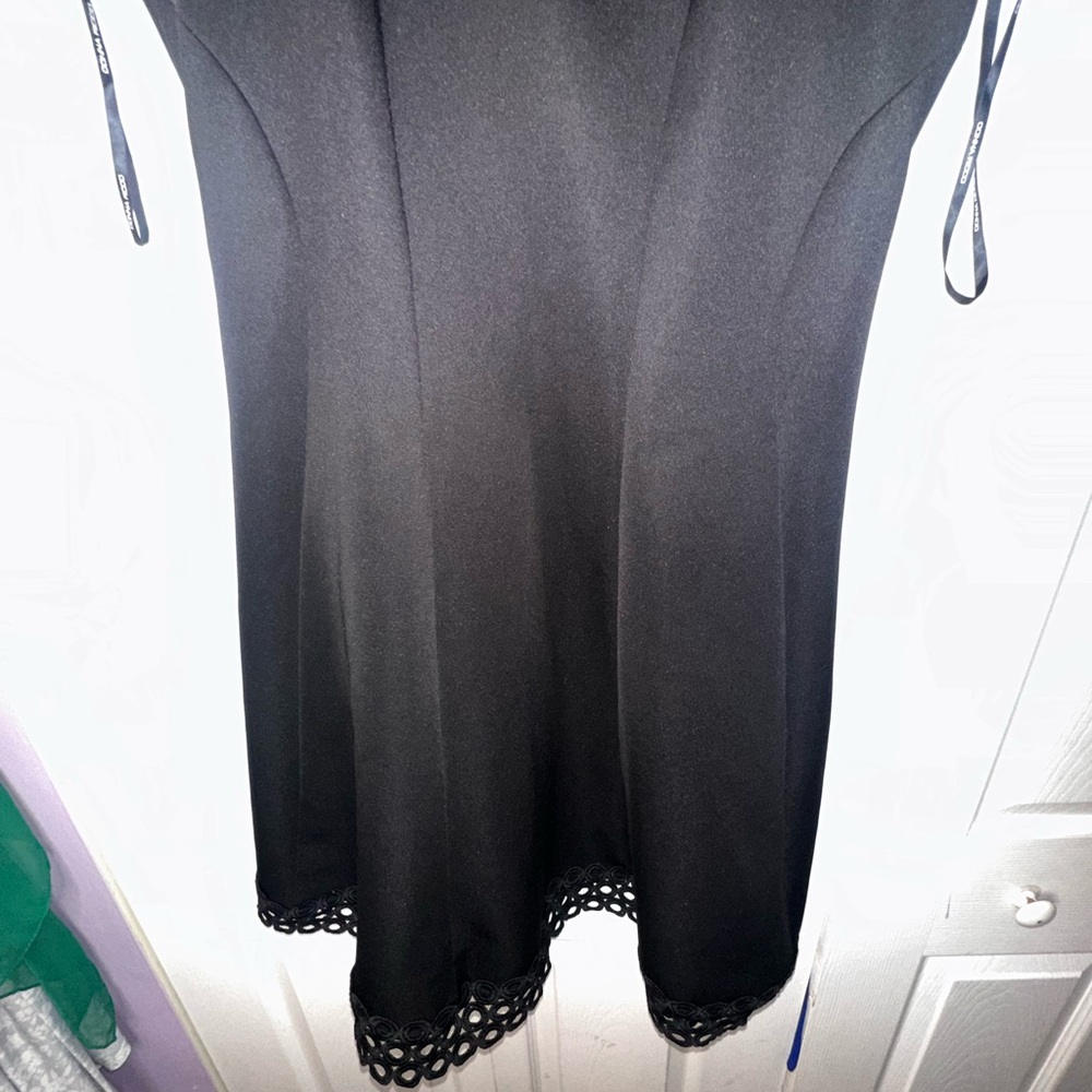 Elegant Black Dress with Lace Hem